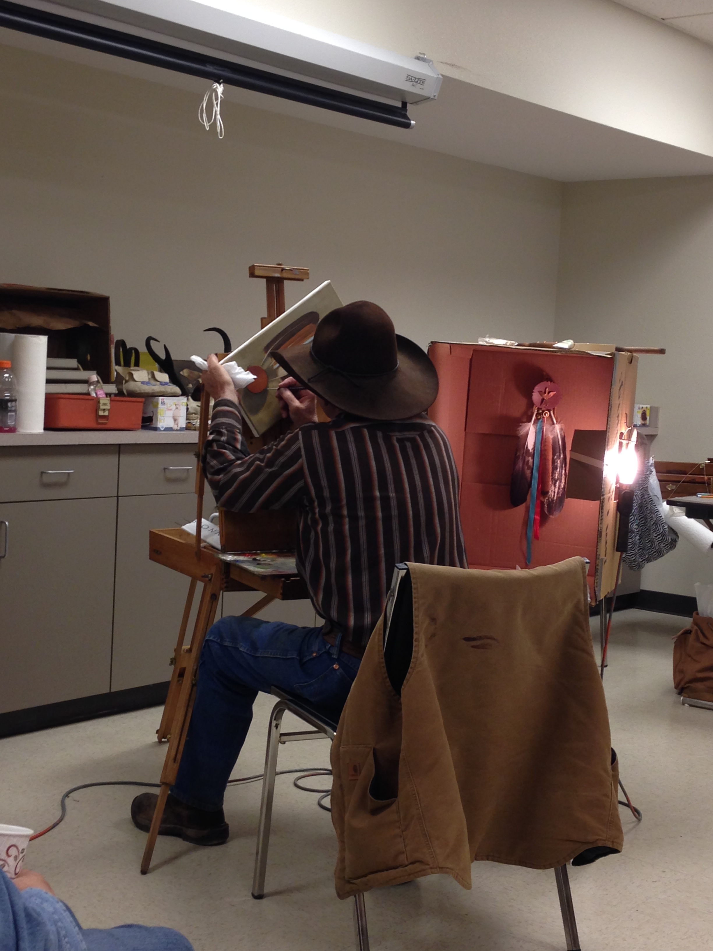 MADORIN: A wizard in a cowboy hat with a paintbrush for his wand