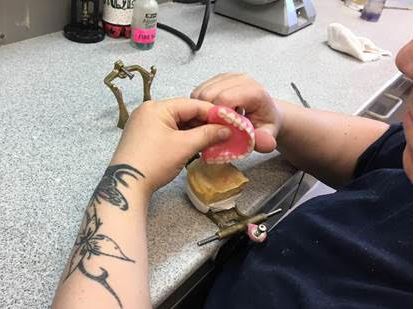 Healthcare providers for needy Kansans learn about Corrections dental lab