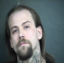 Man shot by police, suspected in Kansas killing, charged